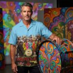 Man_posing_beside_drum_202607222234_2
